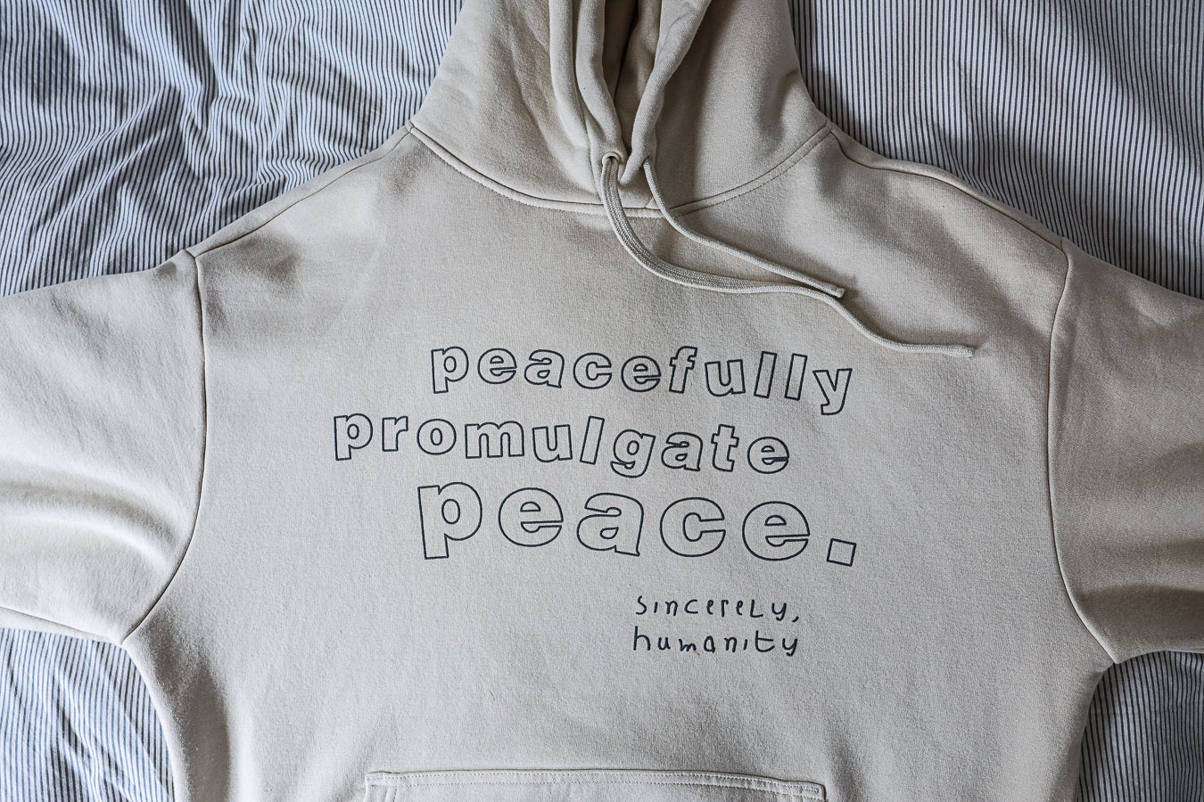 Peacefully Promulgate Peace Hood - Ecru